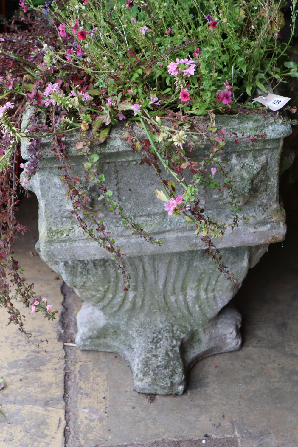 A reconstituted stone rectangular garden planter on trestle stand, length 92cm height 58cm